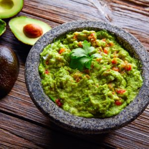 Life-Changing Paleo Guacamole Recipe - This super quick and easy guacamole recipe will quickly become one of your favorite dishes. Be sure to use fresh cilantro and Jalapeno - it's important. | www.grownupdish.com