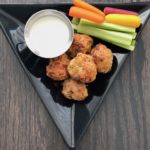 This healthy baked buffalo chicken meatball recipe is savory, spicy and oh so delicious. Serve an appetizer or pile them on top of greens for a satisfying meal. | grownupdish.com