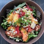 Destined to become your favorite healthy summer salad, this recipe features fresh sweet corn, juicy sweet peaches and tomatoes with a lemon basil vinaigrette. It's Paleo, Whole30, Sugar-Free, Gluten-Free and Vegetarian. | www.grownupdish.com
