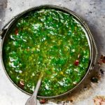 Homemade Paleo Chimichurri Sauce is so much more than just a topper for steaks. It's also delicious on chicken, seafood, potatoes, etc. Chock full of fresh herbs and healthy fats, it will add a boost of flavor to all of your meals. And, you can make it in less than 5 minutes. | www.grownupdish.com