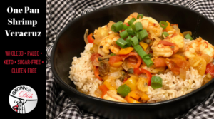 This One Pan Shrimp Veracruz recipe is spicy, saucy, seafood perfection. It's a delicious mixture of tomatoes and two kinds of peppers (baby sweet bell peppers and Jalapeno) with an added flavor pop from capers and a little sweetness from golden raisins.  I know it sounds like a weird list of ingredients, but trust me, it's the bomb dot com. And it's paleo, keto, gluten-free, sugar-free and Whole30 compliant. | www.grownupdish.com