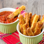 These easy baked zucchini fries feature Parmesan-crusted zucchini baked until hot and crispy and dunked in a smoky, spicy ketchup. You've gotta try these! | www.grownupdish.com