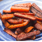 Smoky roasted carrots couldn't be easier, or more delicious. They're the ideal side dish for a quick and healthy weeknight dinner. Try this recipe today! | www.grownupdish.com