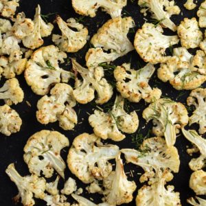 This tumeric roasted cauliflower recipe combines to of today's hottest superfoods. Make it in 30 minutes on a sheet pan - it's ideal for a weeknight dinner. | www.grownupdish.com