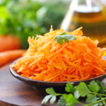 Make this healthy Mexican Carrot Salad with grated carrots, chopped pickled jalapeño peppers, a drizzle of olive oil and cilantro. So crunchy and delicious! | www.grownupdish.com