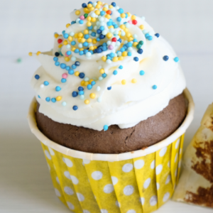The BEST dark chocolate cupcake recipe! It's over-the-top delicious and can be made with gluten-free or all purpose flour. Top with whipped cream or your favorite frosting. | www.grownupdish.com