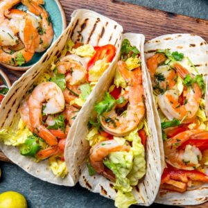 Healthy Weeknight Shrimp Tacos are spicy, flavorful and ready in 30 minutes. Recipe includes Whole30 and gluten-free variations as well as timesaving tips. | www.grownupdish.com