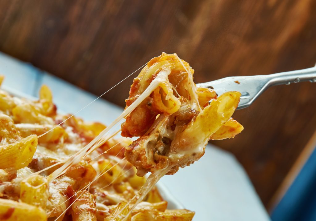 This quick and easy baked ziti recipe uses jarred pasta sauce so you can get dinner on the table in just over 30 minutes. Can be made gluten free. | www.grownupdish.com