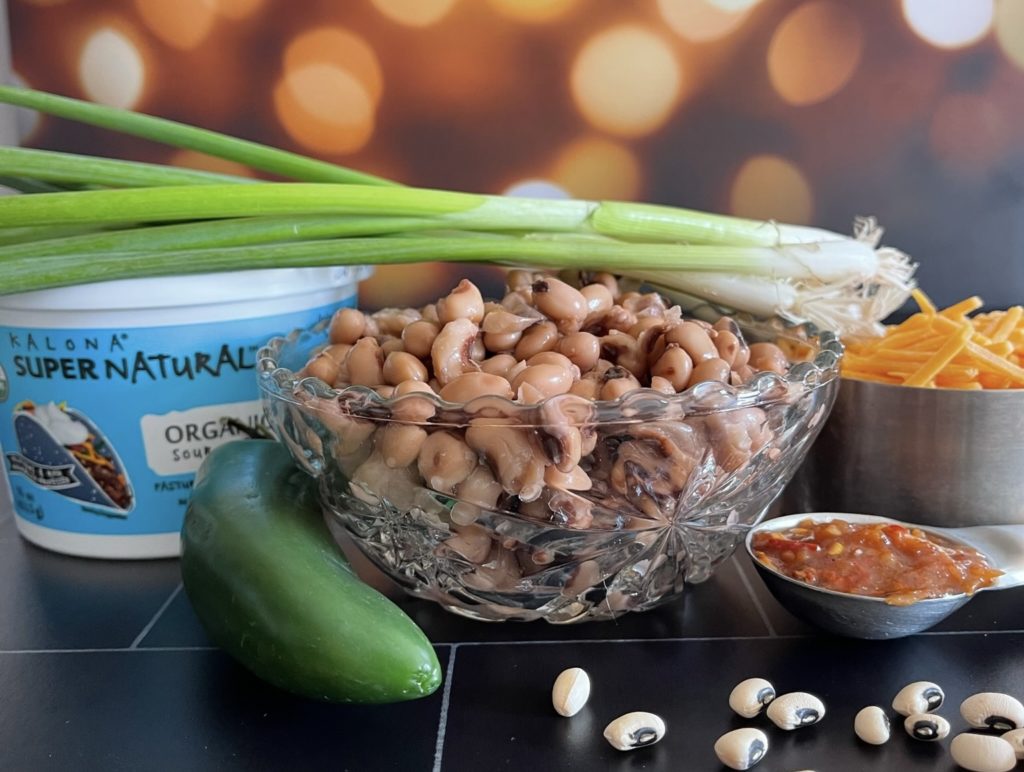 Easy Cheesy Blackeyed Pea dip is easy to make, delicious and sure to bring you lots of good luck in the new year. You've got to try it! | www.grownupdish.com