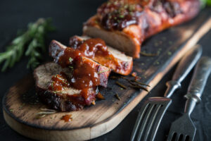 Pork Tenderloin with Maple Garlic Sauce is seasoned, seared and baked in a mouthwatering sauce until it’s sticky on the outside and juicy on the inside. | www.grownupdish.com