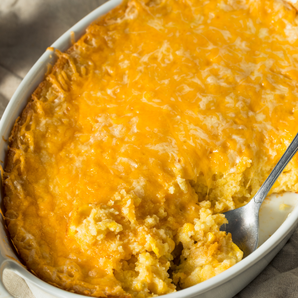 This easy cheesy corn casserole is a no fail recipe that’s perfect for the holidays but easy enough for a weeknight dinner. You've got to try it. | www.grownupdish.com
