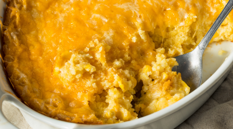 This easy cheesy corn casserole is a no fail recipe that’s perfect for the holidays but easy enough for a weeknight dinner. You've got to try it. | www.grownupdish.com