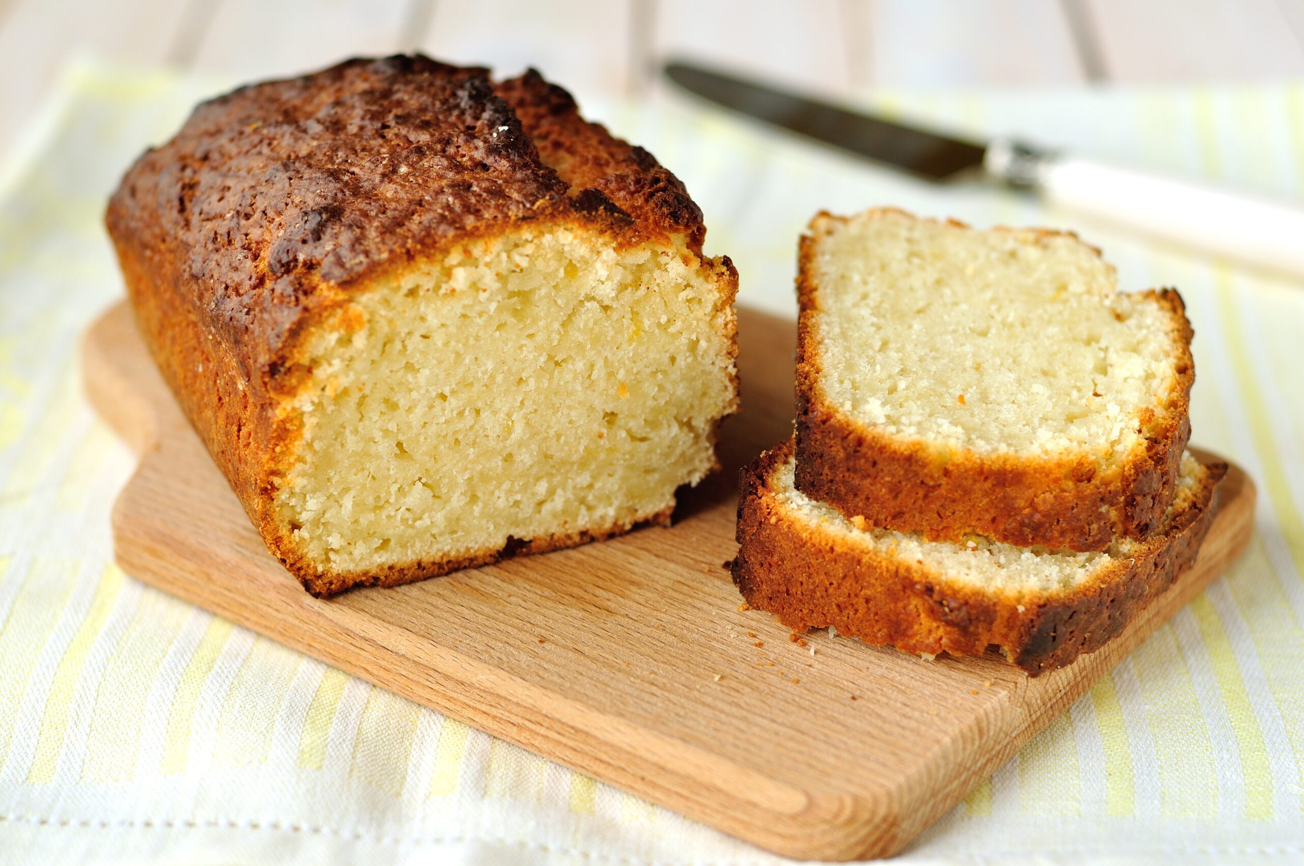 Delicious French yogurt cake is so easy kids can make it. Almost everything gets measured in the yogurt pot & there are endless variations. | www.grownupdish.com