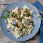 Creamy ravioli with spring vegetables is a delicious vegetarian recipe. It's a healthy easy meal packed with flavor and nutrients. | www.grownupdish.com